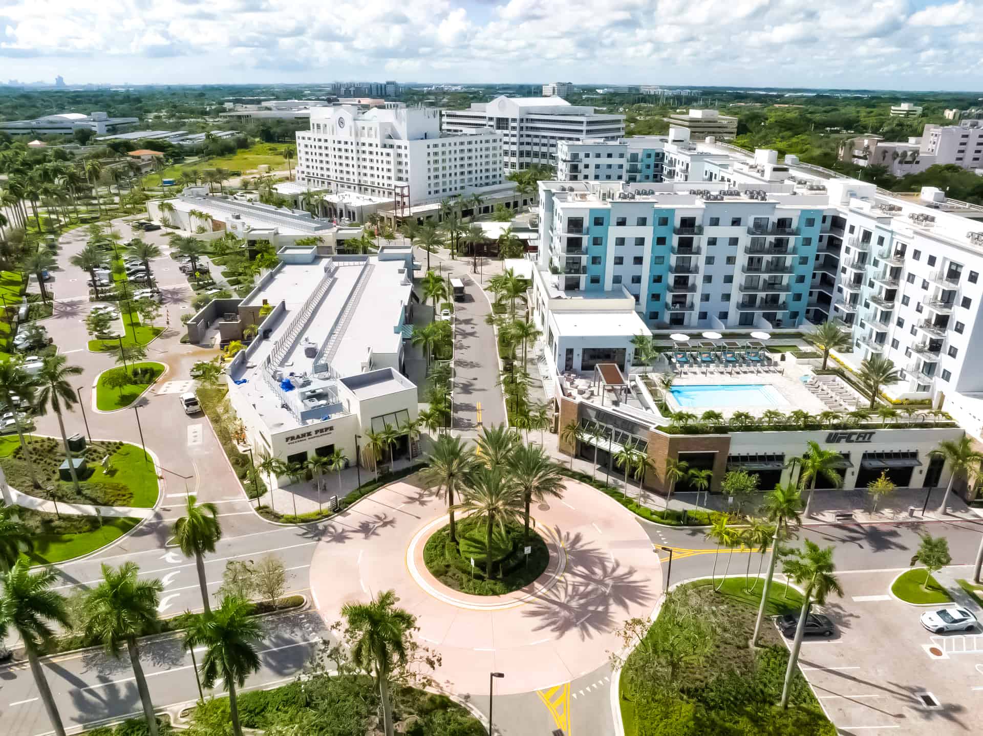 Aerial view of Plantation Walk roundabout, storefronts, and nearby hotel