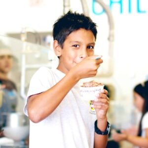 Young boy eating a scoop of Chill-N ice cream