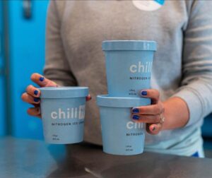 Hands holding pints of Chill-N ice cream