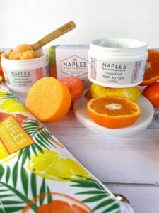 Naples Soap Company Florida Fresh body butter next to orange slices
