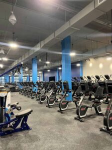 UFC FIT gym with rows of exercise bikes